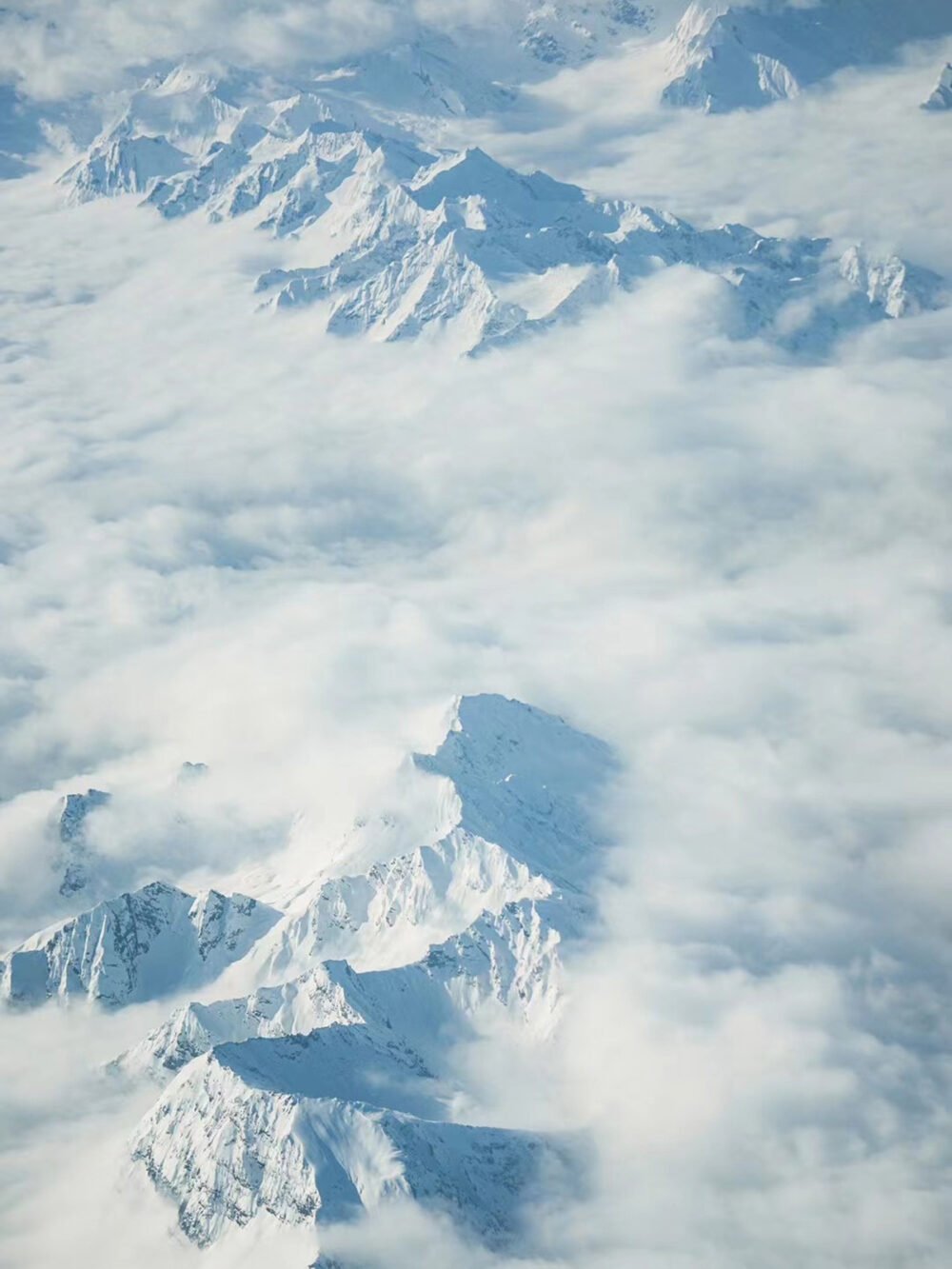 Sea of Clouds and Snowy Peaks